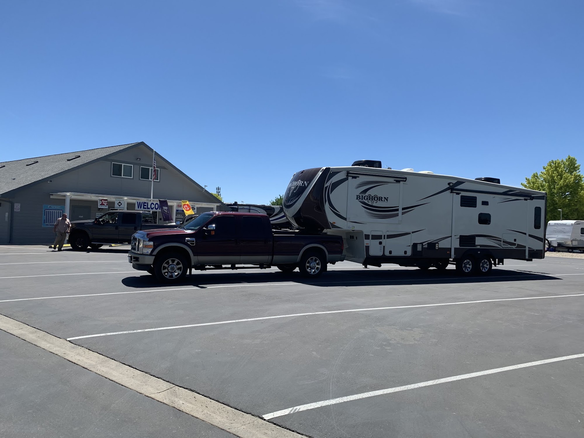 Truck with fifth-wheel RV trailer at Boise Automotive Service parking lot